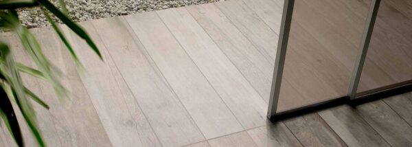 HDG MAPLE 20x120 wood look porcelain transition indoor to outdoor.