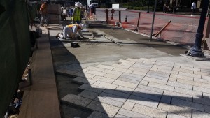 Installation of Tiger Yellow Granite with Round Score Finish Natural Stone Pavers at Horton Plaza San Diego - HDG Building Materials