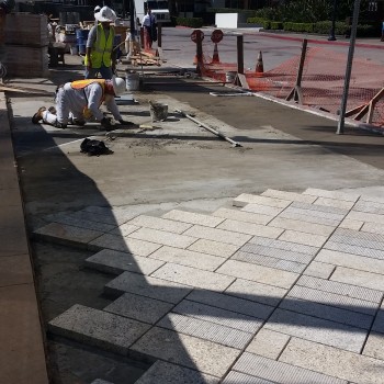 Installation of Tiger Yellow Granite with Round Score Finish Natural Stone Pavers at Horton Plaza San Diego - HDG Building Materials