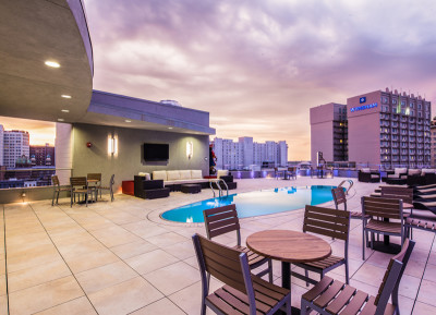 Outdoor Living Rooftop Pool Deck on Canal Street Built with Buzon Pedestals and Porcelain Pavers