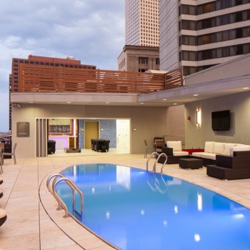 Outdoor Living Rooftop Pool Deck on Canal Street Built with Buzon Pedestals and Porcelain Pavers