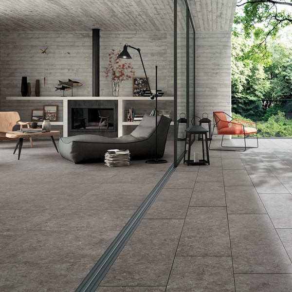 Looking at Transition of Outdoor Living Room and Interior Flooring with HDG NE Gris Grey Limestone Finish Porcelain Pavers