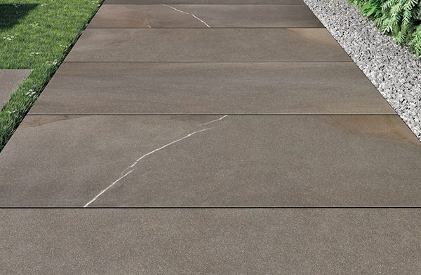 HDG Pietra Pavero Brown Porcelain Pavers EP06 on Grass and Gravel - HDG Building Materials