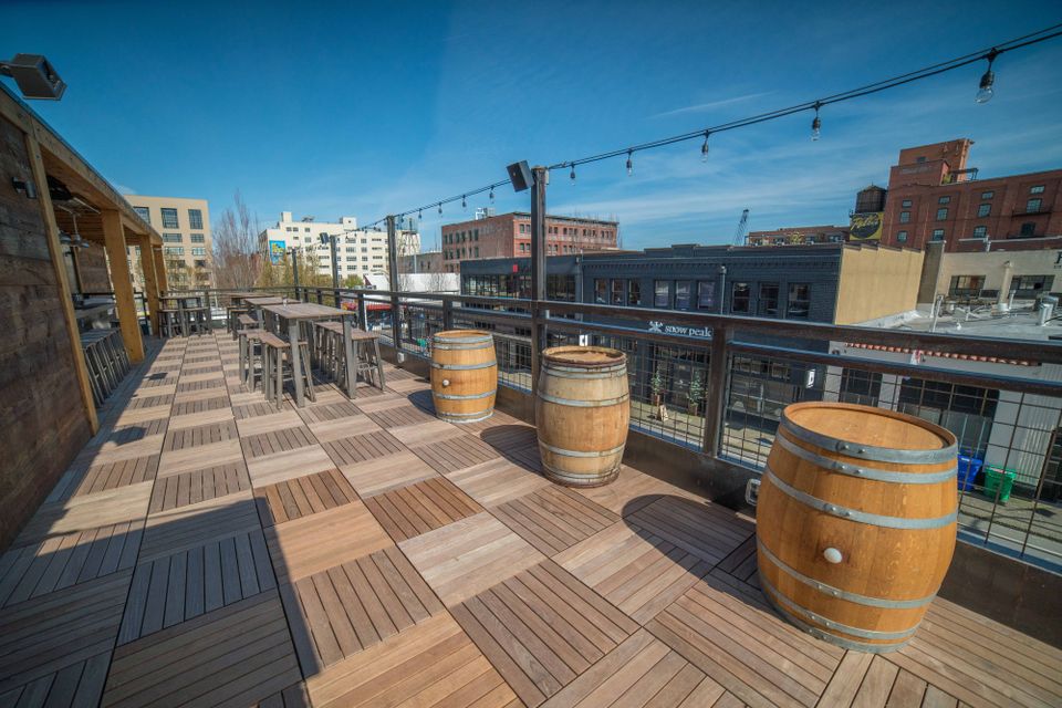 ipe wood deck tiles over Buzon pedestals on rooftop deck - Expert dealer HDG Building Materials