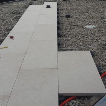 Buzon Pedestals and Porcelain Pavers in Commercial Rooftop Decking Application - HDG Building Materials