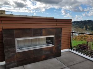 Reysta Horizontal Cladding On Rooftop Dining Area Fireplace - HDG Building Materials