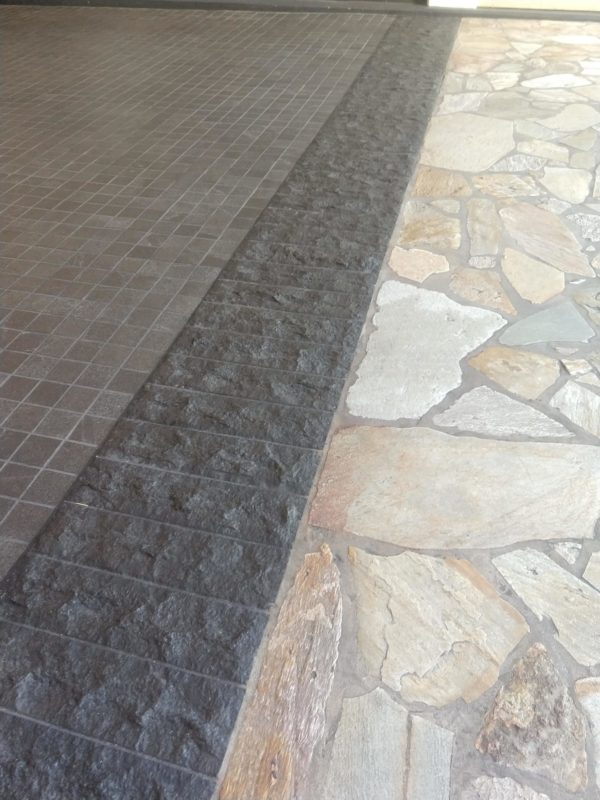 Contrast Adds Visual Appeal to this Limestone Basalt Flagstone Porte-Cochere Driveway - HDG Building Materials
