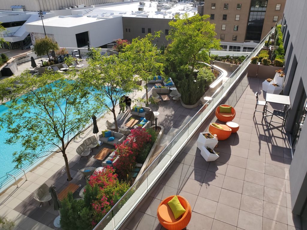 Terrace Overlooking Pool Deck Uses Buzon Pedestals and Concrete Pavers - HDG Building Materials