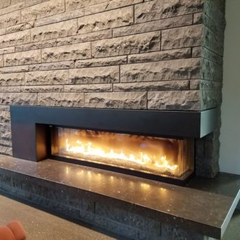 Honed Finish on HDG Perlino Grey Limestone Reduces Glare from Fireplace and Lighting - HDG Building Materials