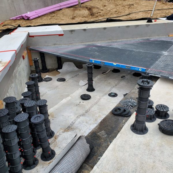 Using Buzon Pedestals and HDG Grating Panels to Design a Sloped Surface Over an Uneven Substrate