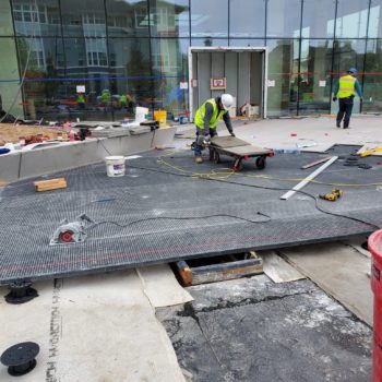 HDG Grating Panels On Slope with Porcelain Pavers and Buzon Pedestals - HDG Building Materials