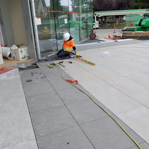 Sloped Surface Design Ties Building Entrance into the Public Sidewalk