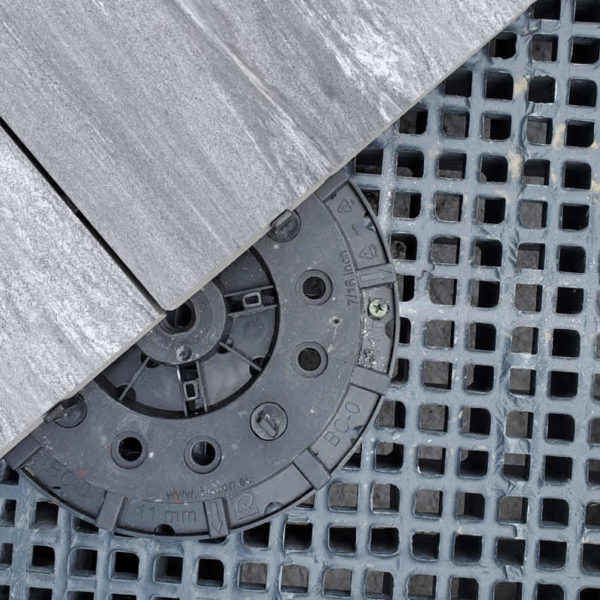 HDG Colo-Tipo 3CM Porcelain Paver with Light Grey Vein-Cut Sandstone Finish - Porcelain Paver over Buzon Pedestal on top of HDG FRP Grating - HDG Building Materials