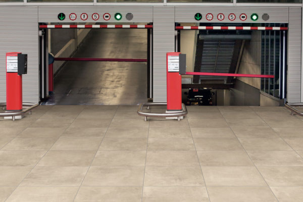 3cm porcelain driveway pavers supporting vehicle traffic in a public garage entrance.
