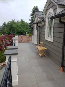 Stone Look Balcony with Porcelain Pavers Over Buzon Pedestals - HDG Building Materials