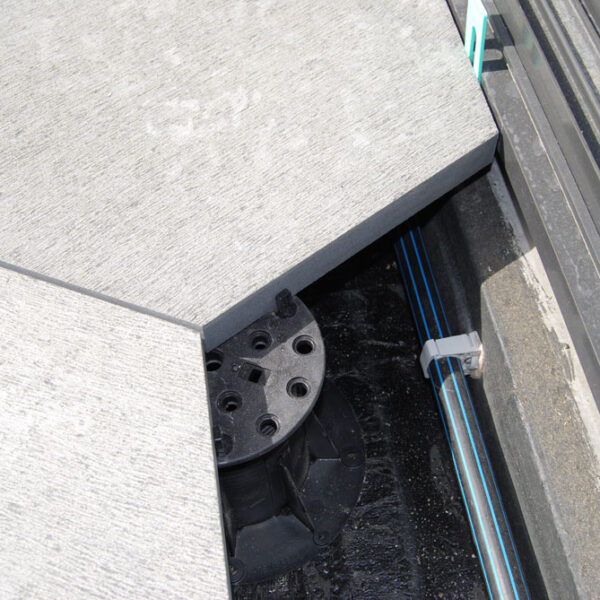 Buzon Pedestals with Spacer Tabs Shows and Services Hidden Below Decking Surface