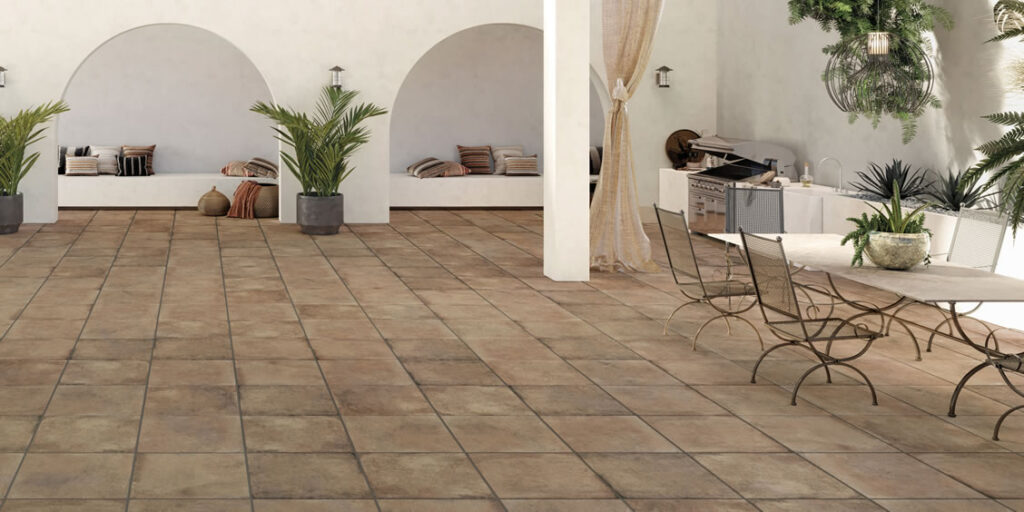 Outdoor Courtyard Dining Area with HDG Copper Porcelain Pavers