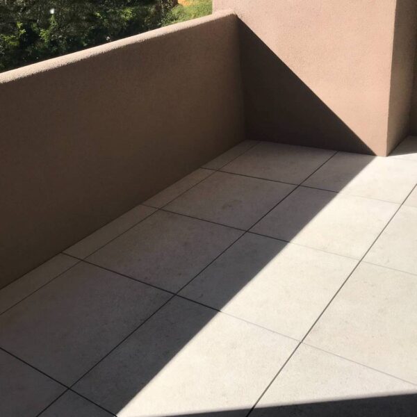 Porcelain Pavers Installed Wall to Wall and Every Corner Without Gaps