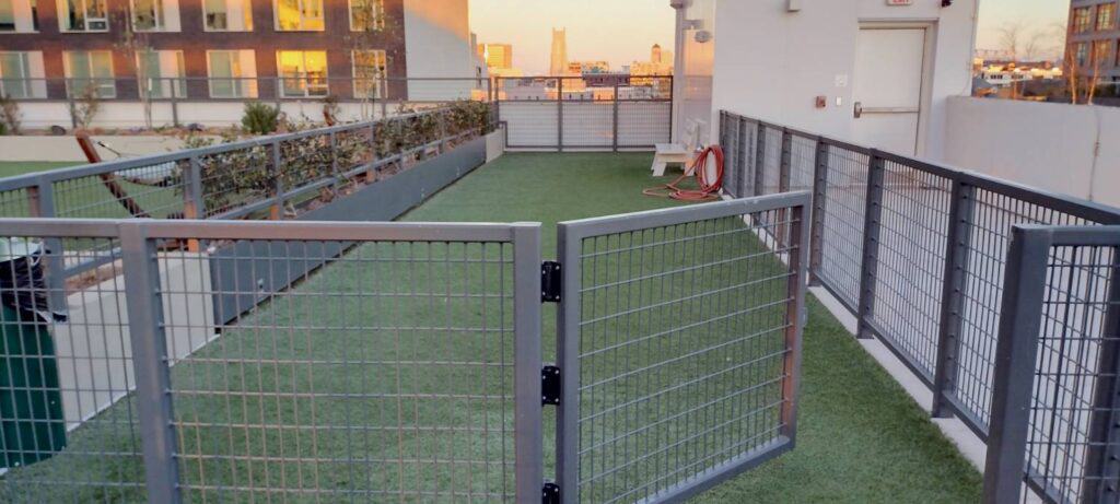 Rooftop Deck is Woof Deck Built with Turf and Mesh Panels