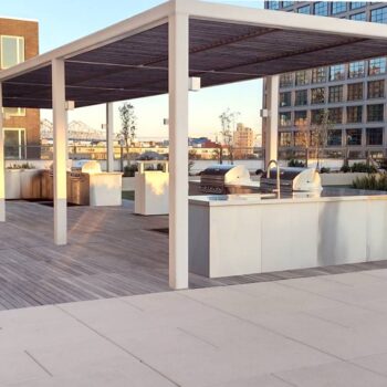 Wood Decking and Porcelain Pavers on Rooftop Woof Deck with Cooking Station
