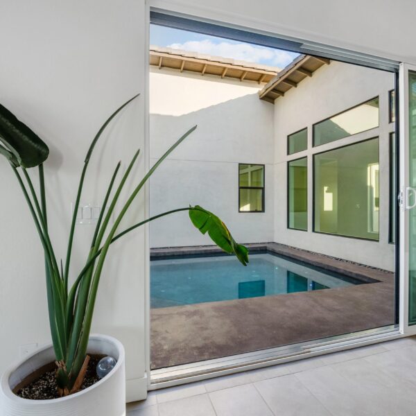 Modern Materials Include Porcelain Pavers and Concrete Pool Surround