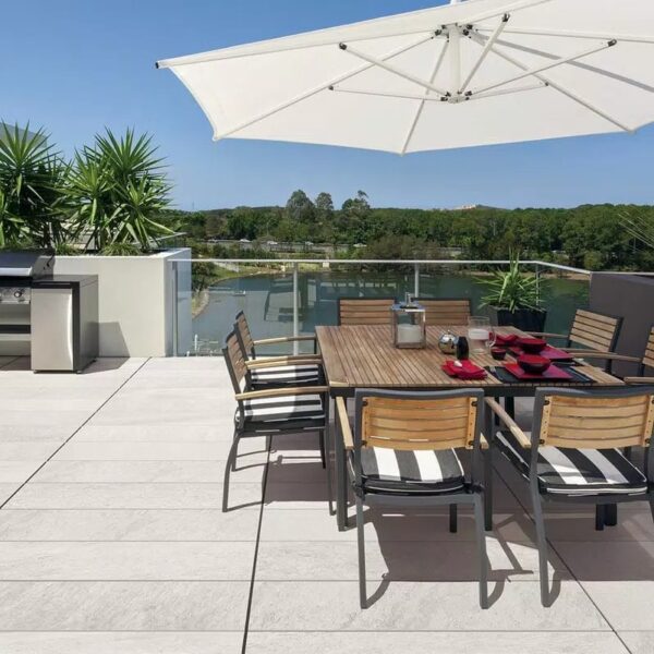 Outdoor Space with BBQ and Seating Area Uses Stone Look Pietra Porcelain Pavers