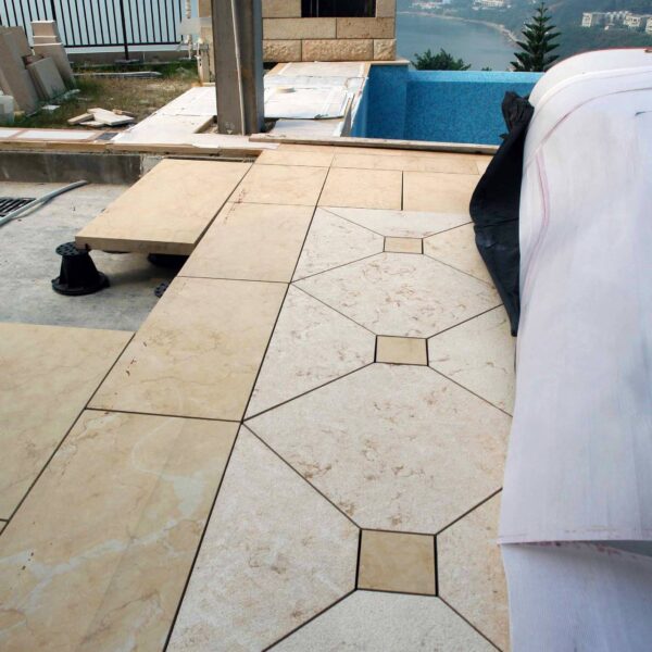 Two Colors of Stone and Many Shapes on this Elevated Stone Deck