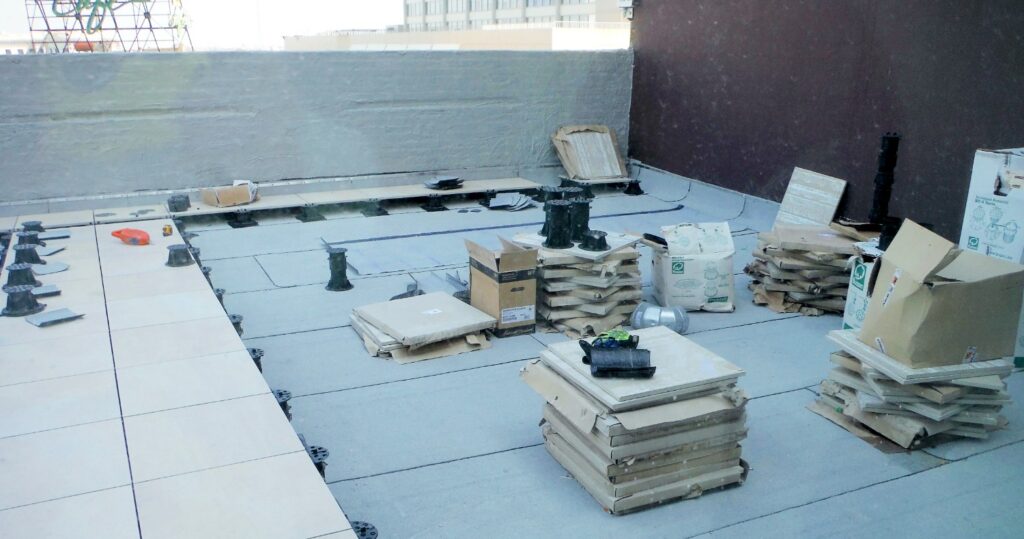 Installing Pedestal Paver System on Canal Street Rooftop Deck