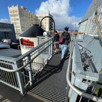Patrons Uses Grating Panels Catwalk as Pedestrian Bridge to Roofdeck