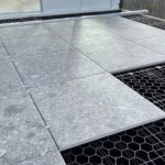 HDG Silca Grate transform a wood deck into a stone deck