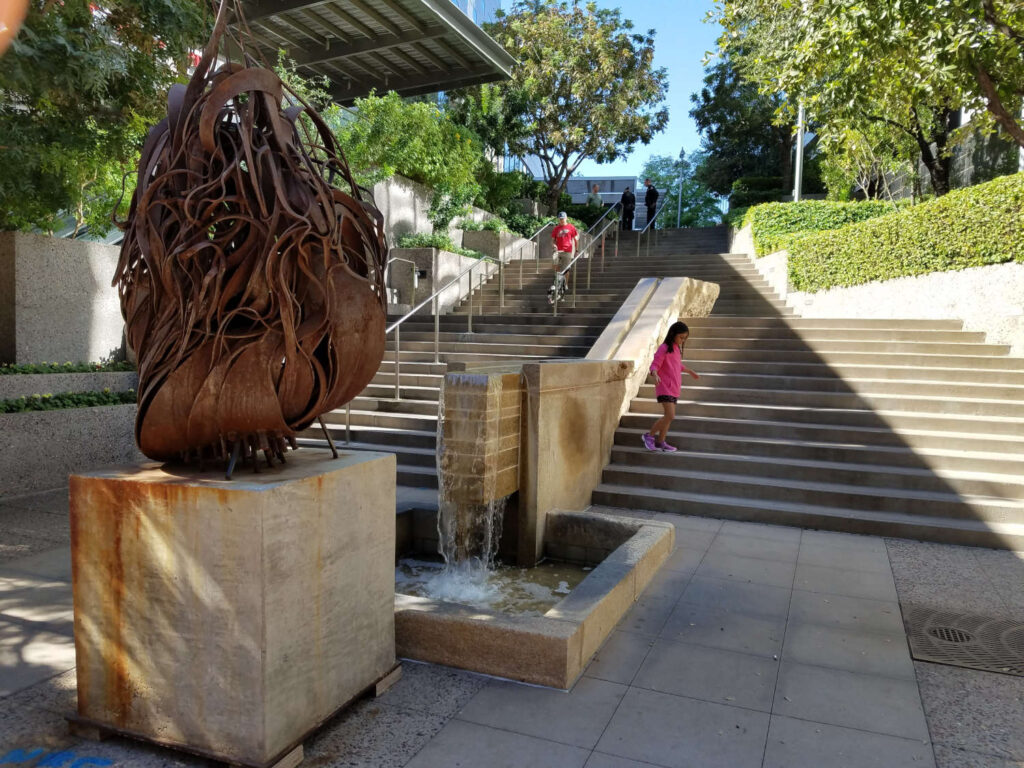 Stone Water Feature Adds Interest and Element of Nature to Stairs in Busy City