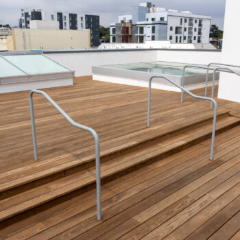 Rooftop Deck Showing Stairs and Accessible Ramp Using ThermoAsh Decking and Buzon Pedestals Close