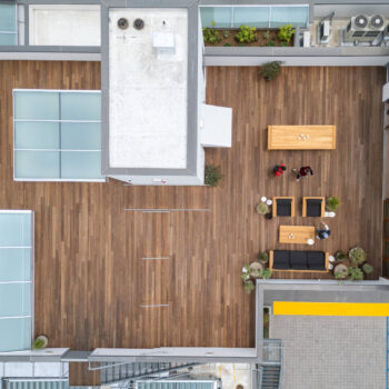 Urban Rooftop Deck Birds-Eye View Showing Skylights Accessible Ramp and Outdoor Living Furniture
