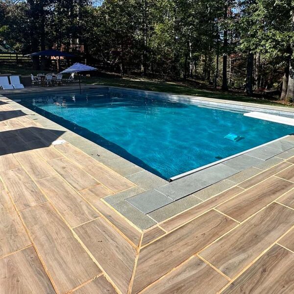 HDG Legno Walnut Porcelain Paver Pool Surround in Residential Application