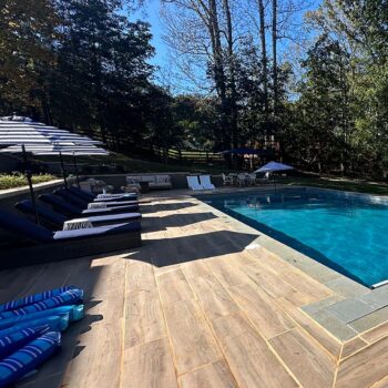 Pool Surround Made With HDG Legno Walnut Porcelain Pavers