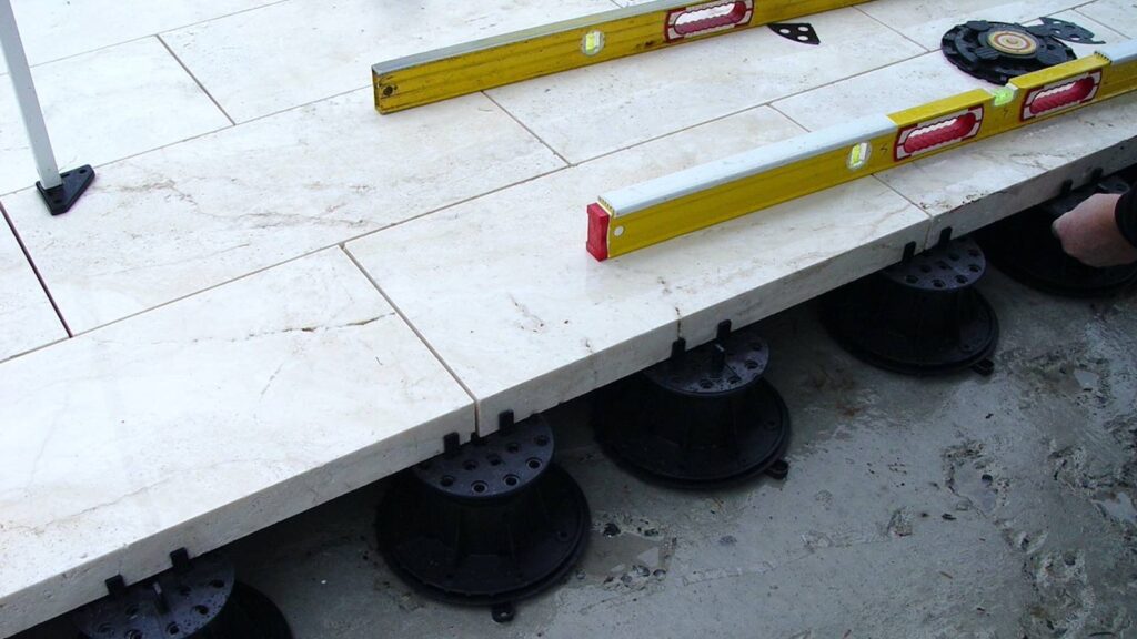 Terrace with Travertine Stone Pavers over Buzon Pedestals with Slope Correction