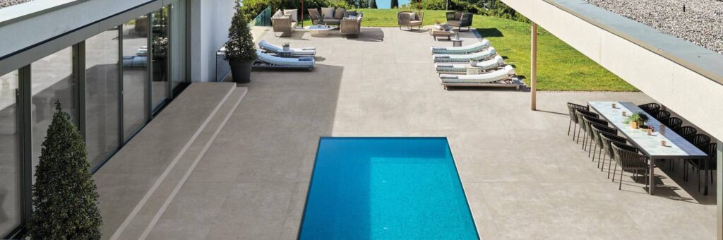 Travertine Pool Deck in Modern Luxury House Outdoor Living Room and Water View