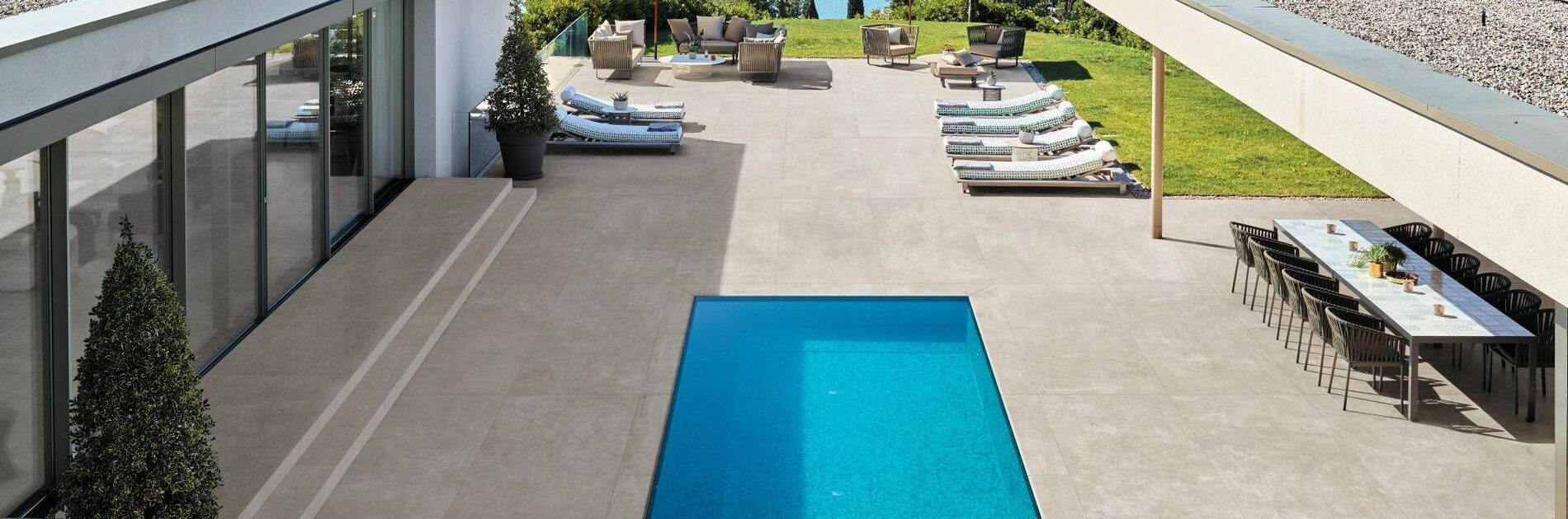 Travertine Pool Deck in Modern Luxury House Outdoor Living Room and Water View