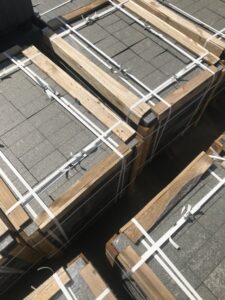 Black Sea Blue Granite slabs secured in a wooden crate, prepared for shipment.