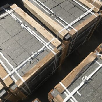 Black Sea Blue Granite slabs secured in a wooden crate, prepared for shipment.