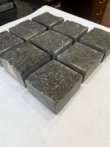 Sample layout of HDG Black Sea Blue Granite cobblestones arranged for paving design visualization.