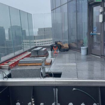 Kerf-Cut Grey Granite Pavers to Resist Wind Uplift