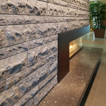 Limestone Cladding with Mushroom Finish and Fireplace with Honed Limestone