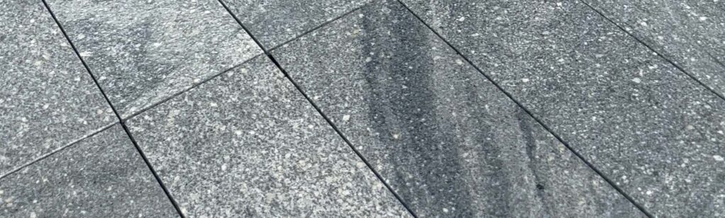 Grey granite stone with veins on Boston South Station pool deck and terrace