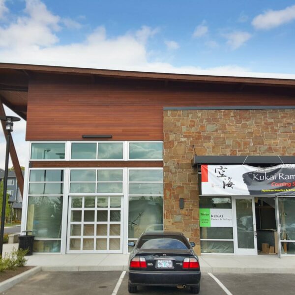 Resysta Siding Adjacent Natural Stone Adds Visual Contrast