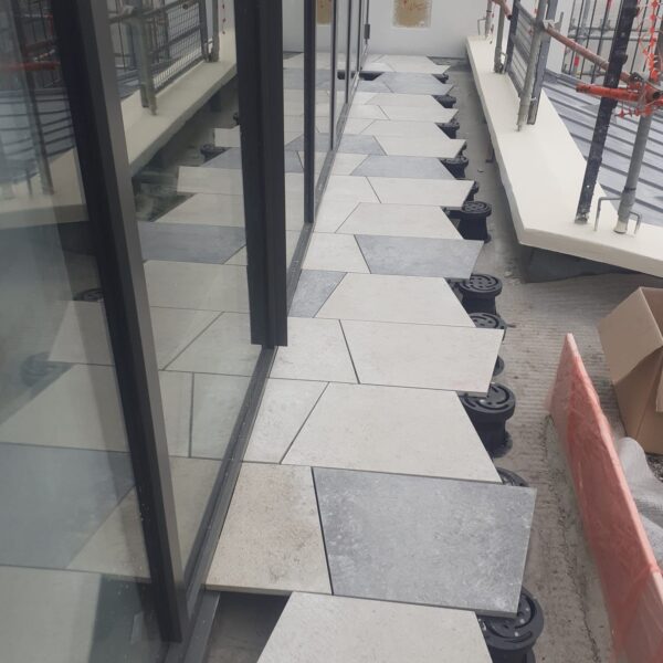 Commercial Rooftop Deck with Trapezoid Porcelain Pavers Over Buzon U-TOP-Flex Pedestals