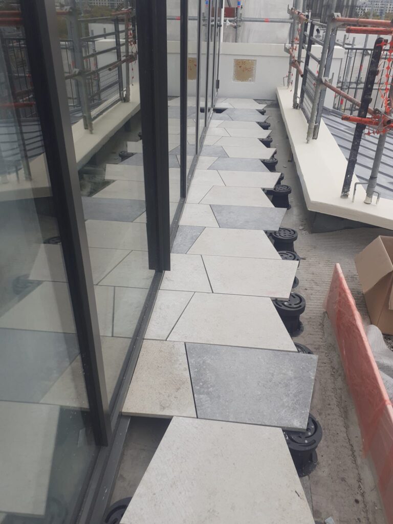 Commercial Rooftop Deck with Trapezoid Porcelain Pavers Over Buzon U-TOP-Flex Pedestals