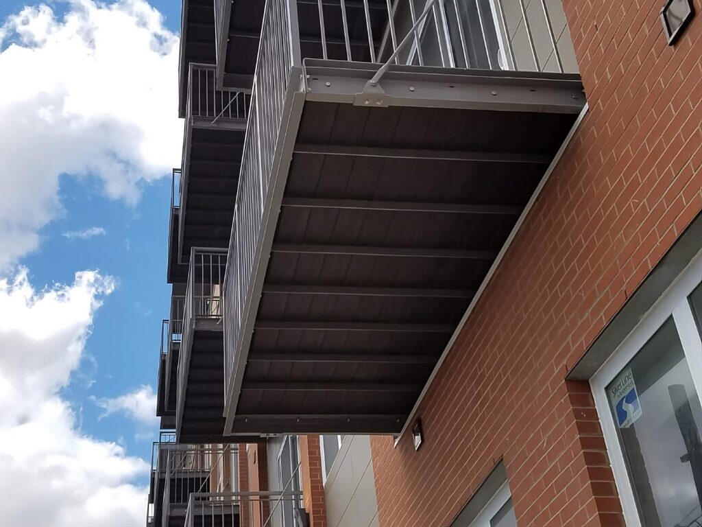 Looking up at Waterproof DuxxBak Multifamily Deck Bottom