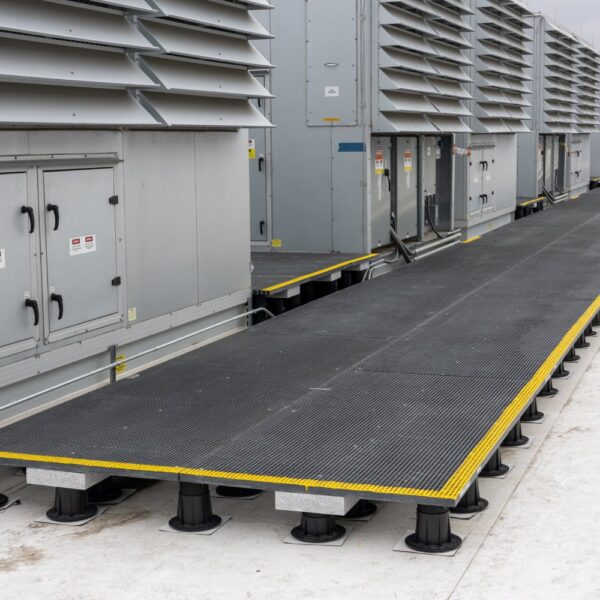 Long view of rooftop access system spanning multiple equipment banks with step transitions