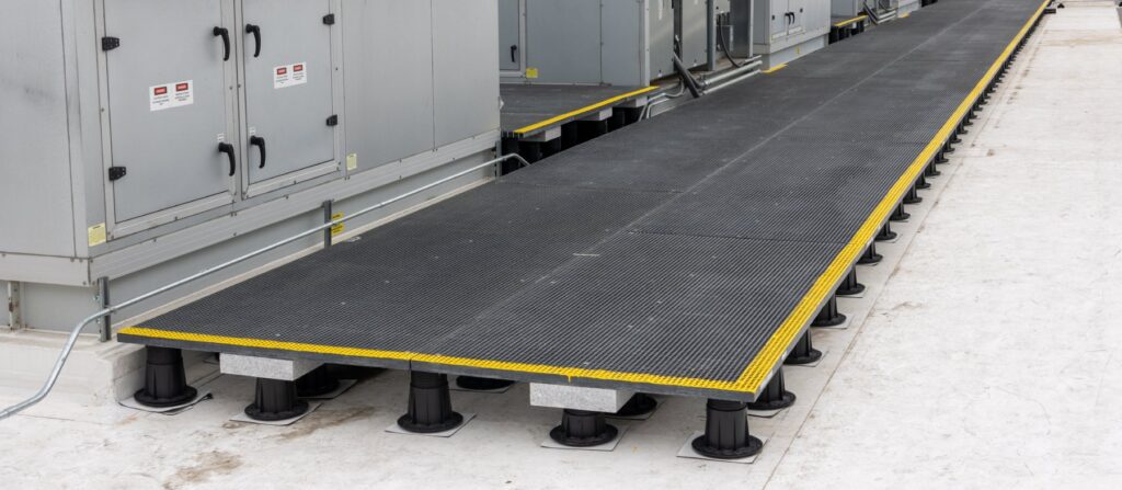 Long view of rooftop access system spanning multiple equipment banks with step transitions